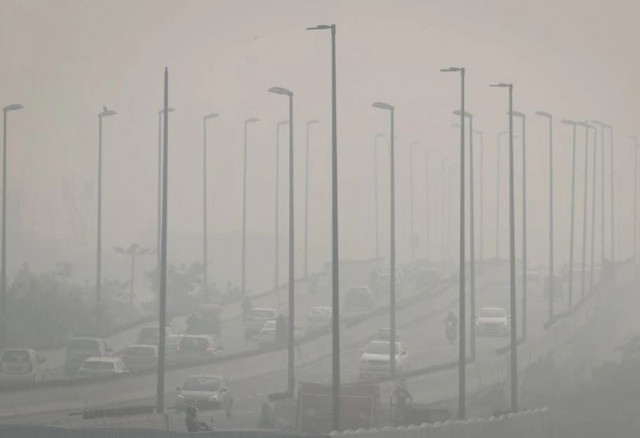 traffic moves on a flyover on a smoggy morning in new delhi india november 4 2021 photo reuters