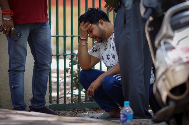man cries after his newborn child went missing following a fire at a baby care hospital in new delhi india may 26 2024 photo reuters man cries after his newborn child went missing following a fire at a baby care hospital in new delhi india may 26 2024 photo reuters