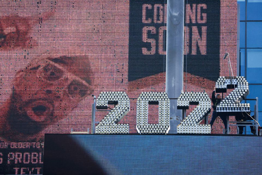 Workers add the number 2 to the numerals above Times Square ahead of New Year's Eve celebrations in Manhattan, New York City, U.S., December 26, 2021. PHOTO: REUTERS