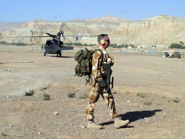 a soldier form new zealand patrols an airstrip in the central province of bamiyan afghanistan photo reuters file