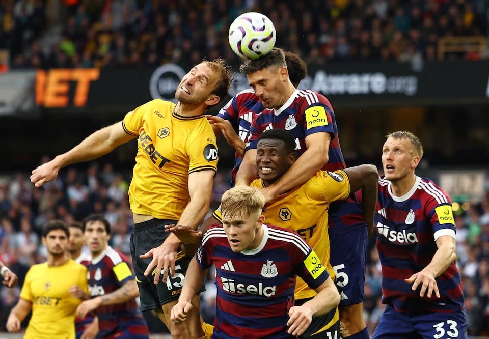 wolverhampton wanderers craig dawson in action with newcastle united s fabian schar during premier league match between wolverhampton wanderers vs newcastle united at molineux stadium wolverhampton britain on september 15 2024 photo reuters