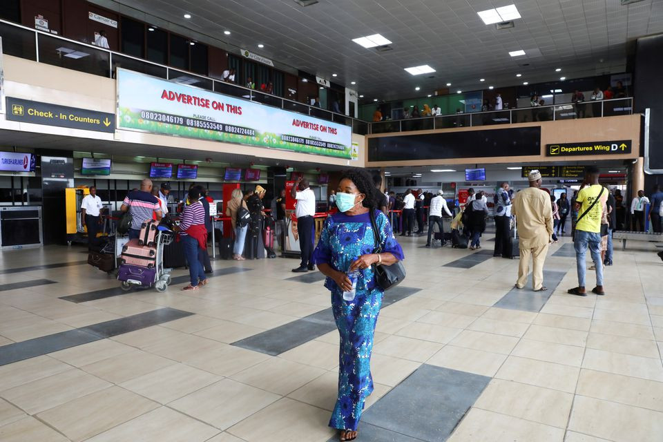 a woman wears a protective face mask due to the spread of the coronavirus disease covid 19 at the murtala mohammed international airport in lagos nigeria march 19 2020 photo reuters