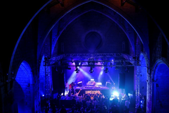 revellers wearing protective face masks dance inside la merce cultural center during open girona initiative which aims to provide a pilot digital health pass scheme to reopen restaurants and businesses amid the coronavirus disease covid 19 pandemic in girona spain may 1 2021 photo reuters revellers wearing protective face masks dance inside la merce cultural center during open girona initiative which aims to provide a pilot digital health pass scheme to reopen restaurants and businesses amid the coronavirus disease covid 19 pandemic in girona spain may 1 2021 photo reuters