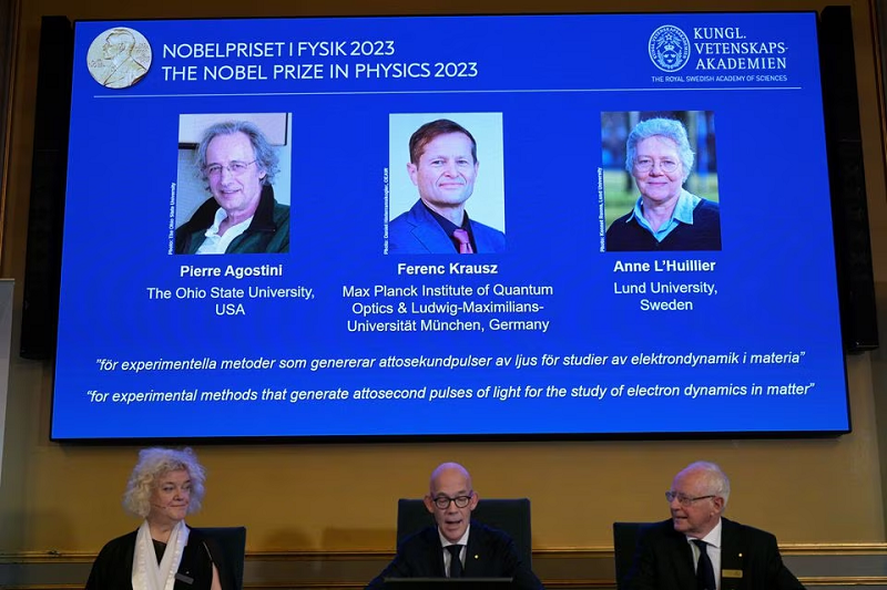 hans ellegren permanent secretary of the royal academy of sciences flanked by eva olsson and mats larsson members announces this year s nobel prize winners in physics at the royal academy of sciences in stockholm sweden october 3 2023 photo reuters