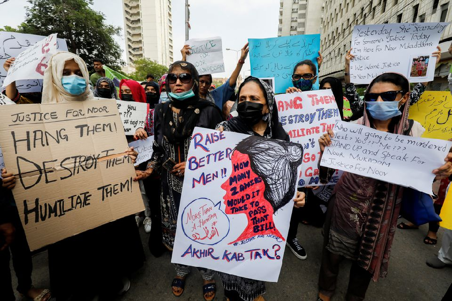 people carry signs against the killing of noor mukadam 27 daughter of former pakistani diplomat and to condemn the violence against women and girls during a protest in karachi pakistan july 25 2021 photo reuters