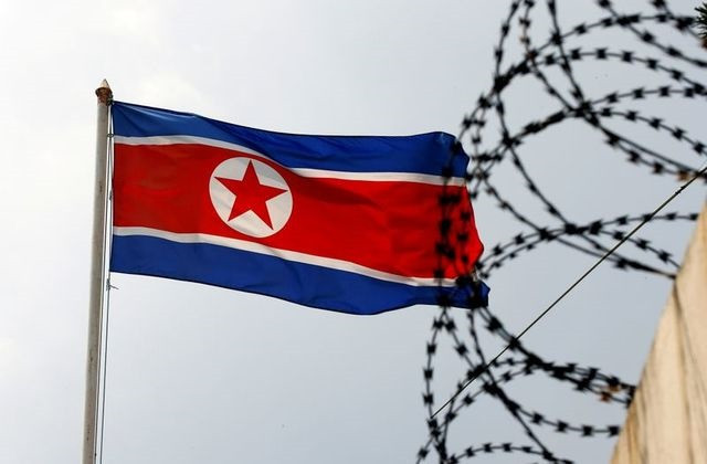 a north korea flag flutters next to concertina wire at the north korean embassy in kuala lumpur malaysia march 9 2017 photo reuters