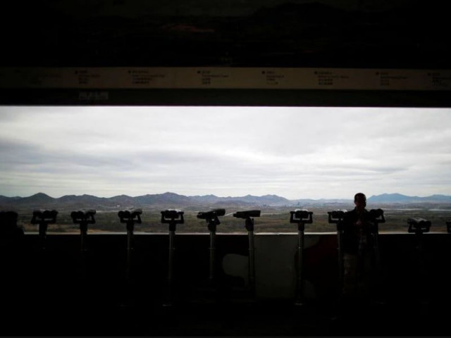 a man stands near binoculars as he tries to see north korea s propaganda village of gijungdong at the dora observatory near the demilitarised zone separating the two koreas in paju south korea april 24 2018 photo reuters file a man stands near binoculars as he tries to see north korea s propaganda village of gijungdong at the dora observatory near the demilitarised zone separating the two koreas in paju south korea april 24 2018 photo reuters file