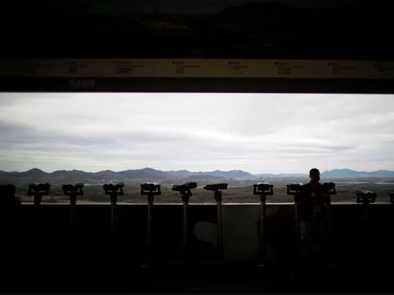 a man stands near binoculars as he tries to see north korea s propaganda village of gijungdong at the dora observatory near the demilitarised zone separating the two koreas in paju south korea april 24 2018 photo reuters file a man stands near binoculars as he tries to see north korea s propaganda village of gijungdong at the dora observatory near the demilitarised zone separating the two koreas in paju south korea april 24 2018 photo reuters file