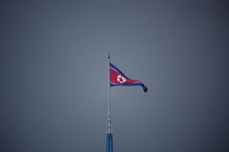 a north korean flag flutters at the propaganda village of gijungdong in north korea july 19 2022 photo reuters