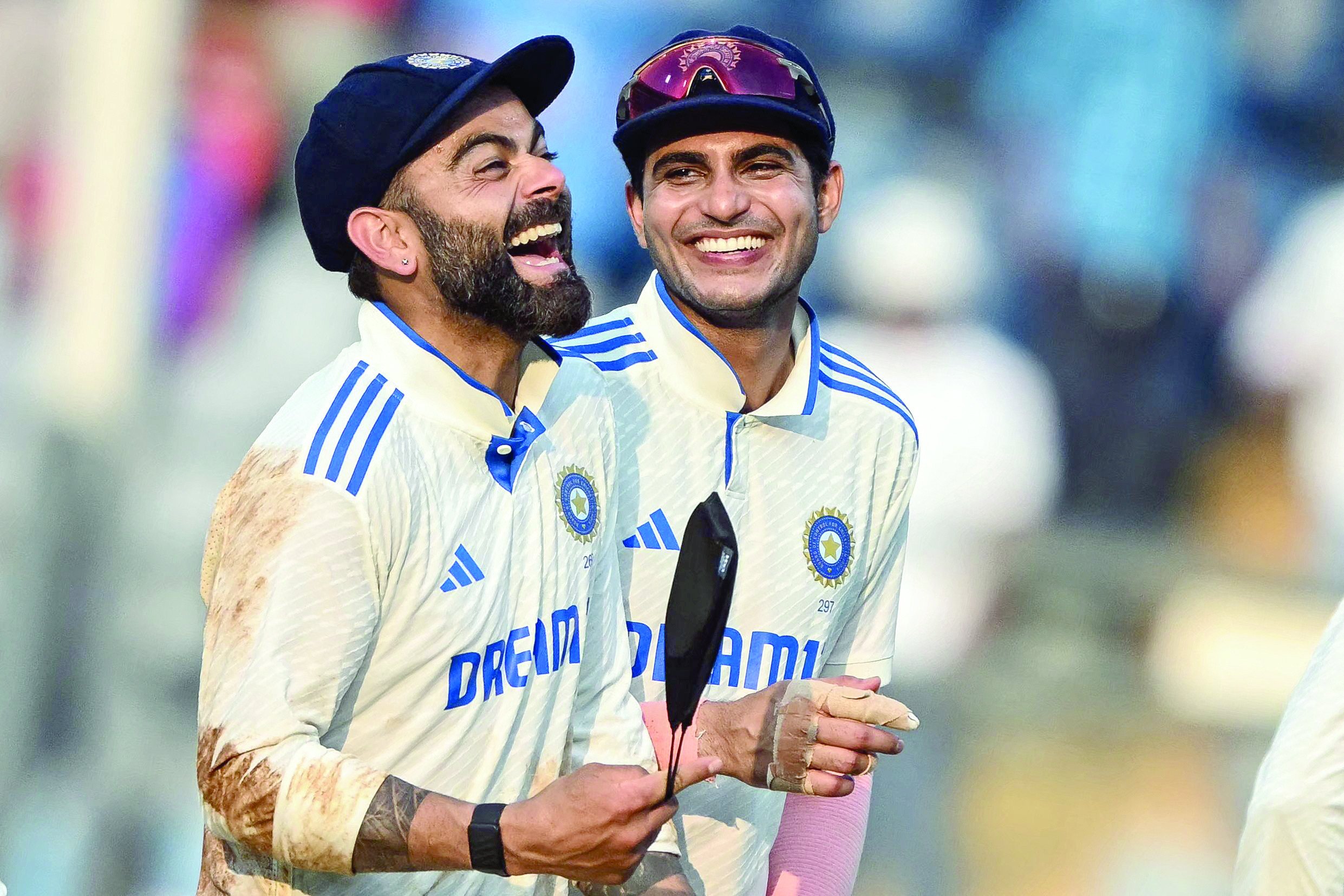 india s virat kohli and shubman gill r react as they walk back to the pavilion at the end of second day of the third and final test cricket match against new zealand at wankhede stadium photo afp