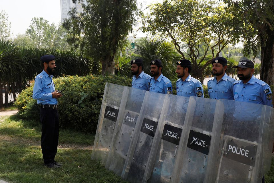 police officers stand guard on the road leading towards the red zone in islamabad pakistan april 4 2022 reuters akhtar soomro