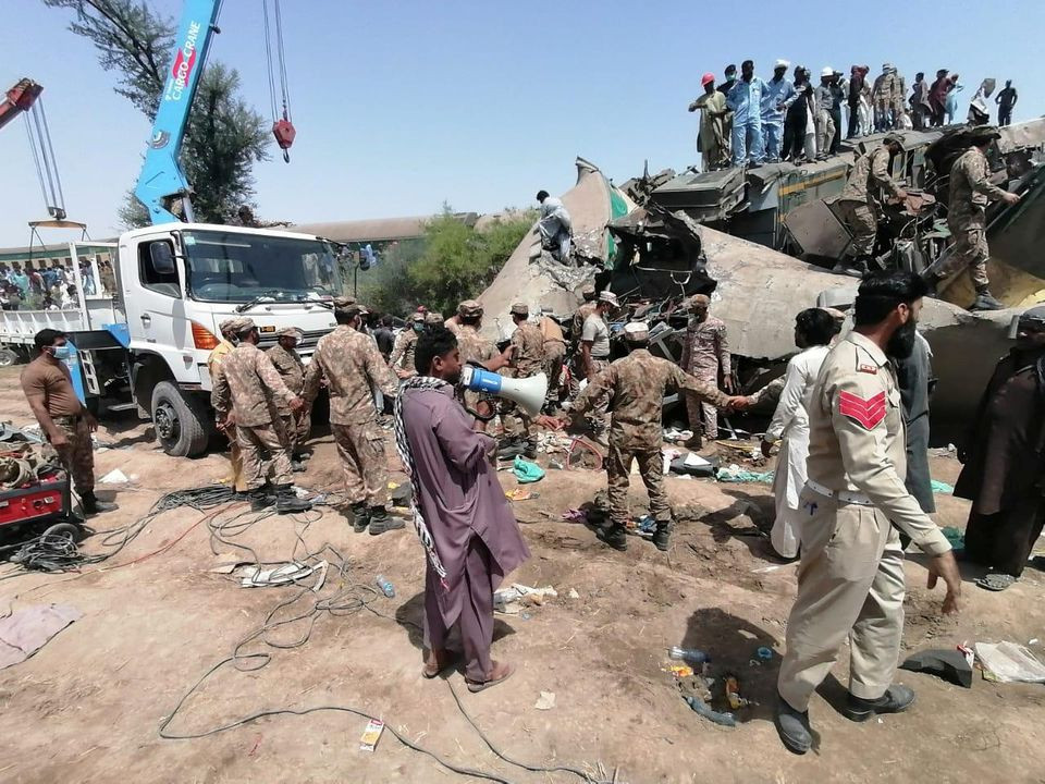 paramilitary soldiers and rescue workers gather at the site following a collision between two trains in ghotki pakistan june 7 2021 photo reuters