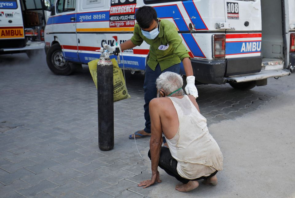 a patient with a breathing problem is helped by his relative to enter a covid 19 hospital for treatment amidst the spread of the coronavirus disease covid 19 in ahmedabad india april 19 2021 reuters