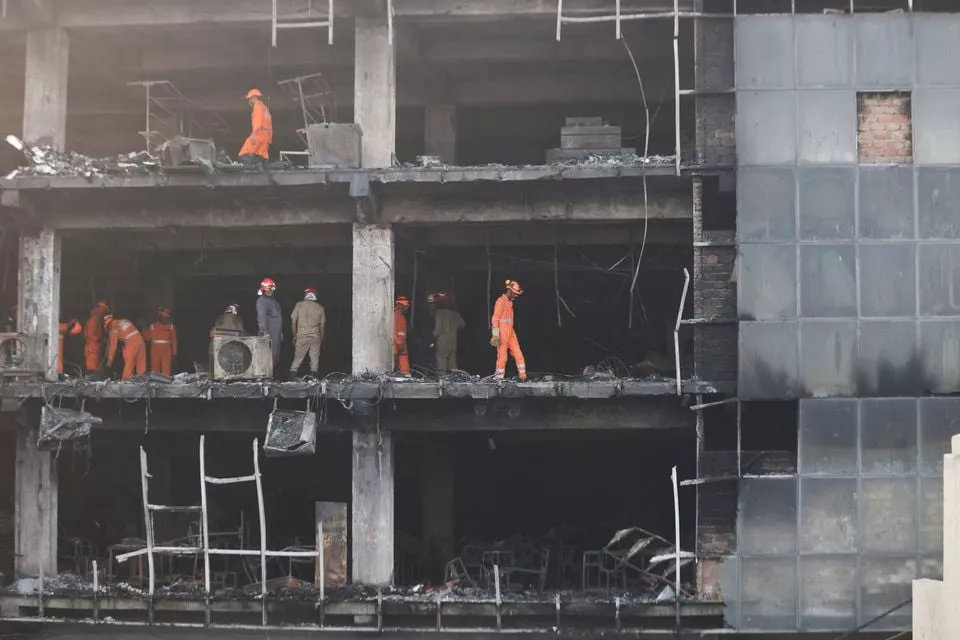 national disaster response force ndrf and fire brigade personnel conduct a search and rescue operation after a fire broke out in a commercial building in new delhi india may 14 2022 reuters national disaster response force ndrf and fire brigade personnel conduct a search and rescue operation after a fire broke out in a commercial building in new delhi india may 14 2022 reuters
