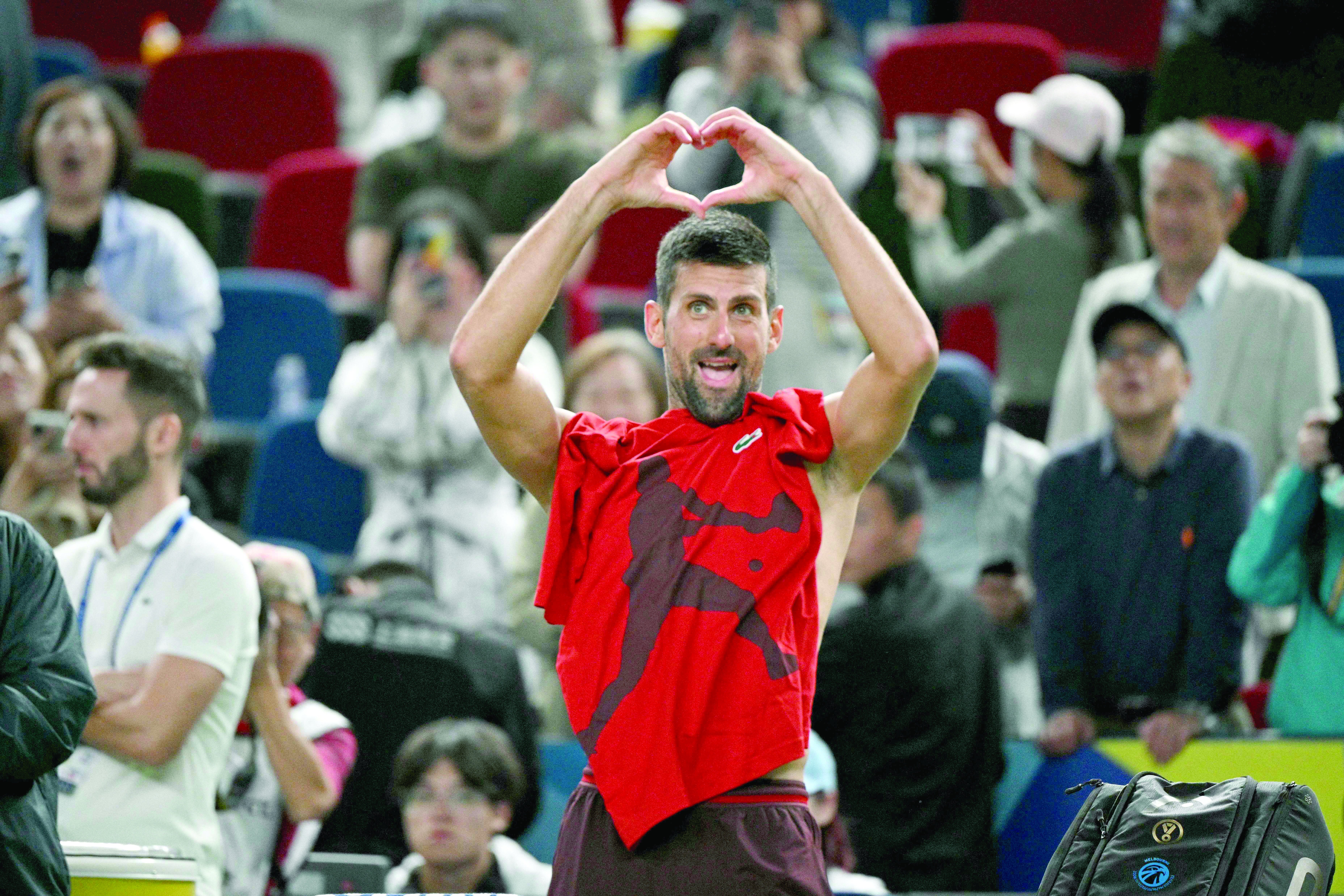 novak djokovic celebrates after his victory against taylor fritz in their semi final match during the shanghai masters tennis tournament photo afp