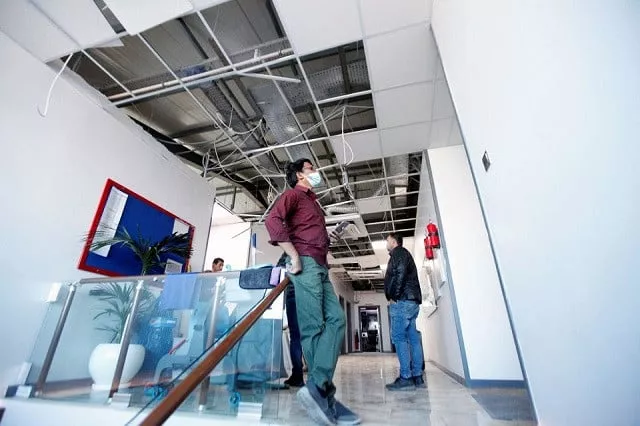 workers clean the damaged office of kurdistan 24 tv building in the aftermath of missile attacks in erbil iraq march 13 2022 photo reuters workers clean the damaged office of kurdistan 24 tv building in the aftermath of missile attacks in erbil iraq march 13 2022 photo reuters