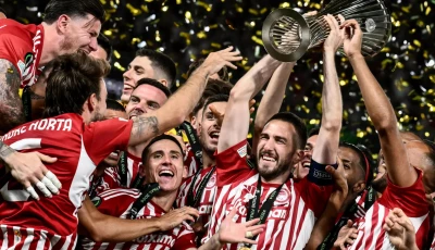 champions olympiakos konstantinos fortounis c holding the europa conference league trophy photo afp
