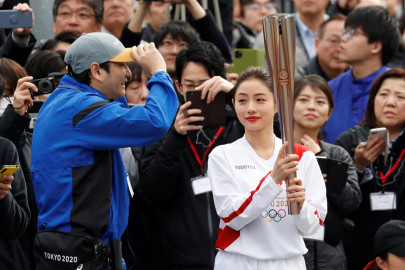 new start date for virus delayed olympic torch relay