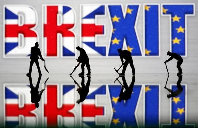 small toy figures are seen in front of a brexit logo in this illustration picture march 30 2019 photo reuters