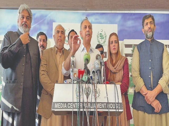 national assembly opposition leader omar ayub flanked by key pti leaders addresses the media in islamabad photo nni