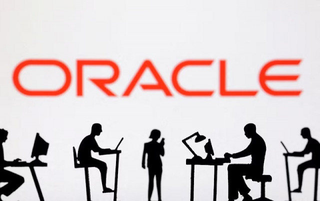 figurines with computers and smartphones are seen in front of oracle logo in this illustration taken february 19 2024 photo reuters figurines with computers and smartphones are seen in front of oracle logo in this illustration taken february 19 2024 photo reuters