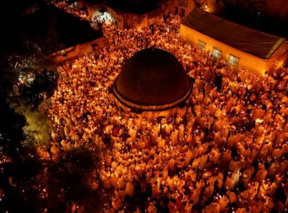 in pictures holy fire lights up jerusalem s holy sepulchre