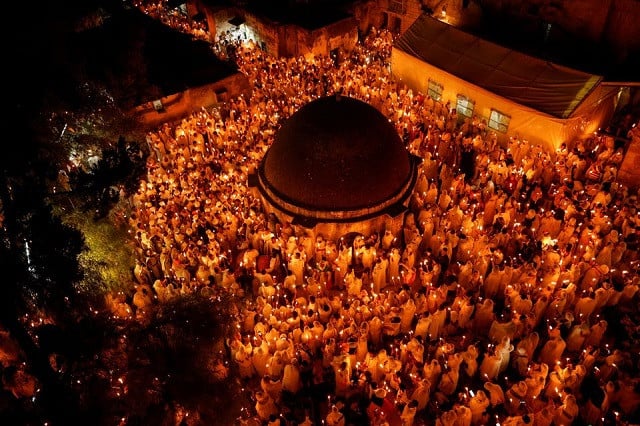 ethiopian orthodox worshippers hold candles during the holy fire ceremony at the ethiopian section of the church of the holy sepulchre in jerusalem s old city april 23 2022 photo reuters