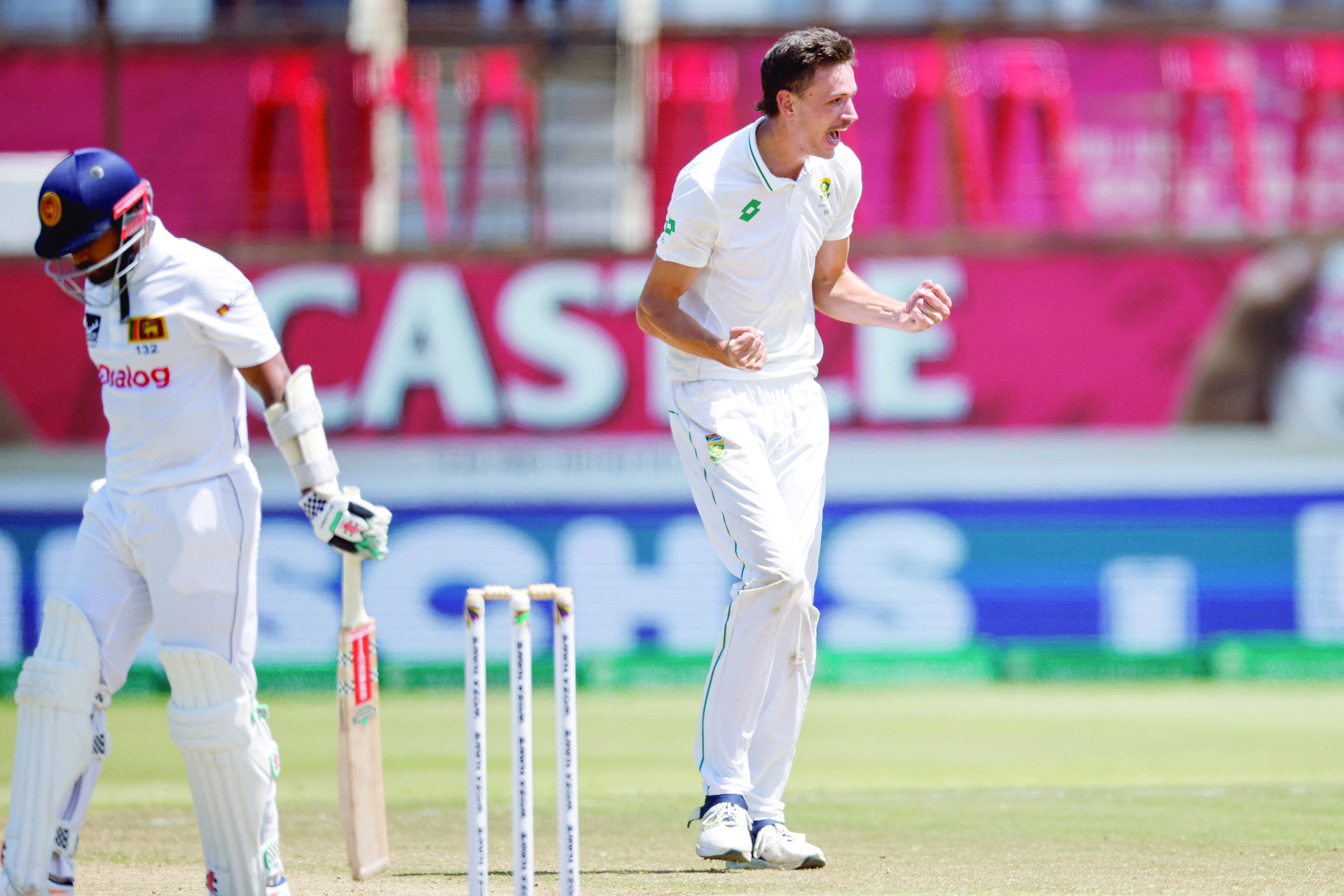 south africa s marco jansen r celebrates after dismissing sri lanka s vishwa fernando l on the fourth day of the first cricket test match at the kingsmead stadium in durban photo afp