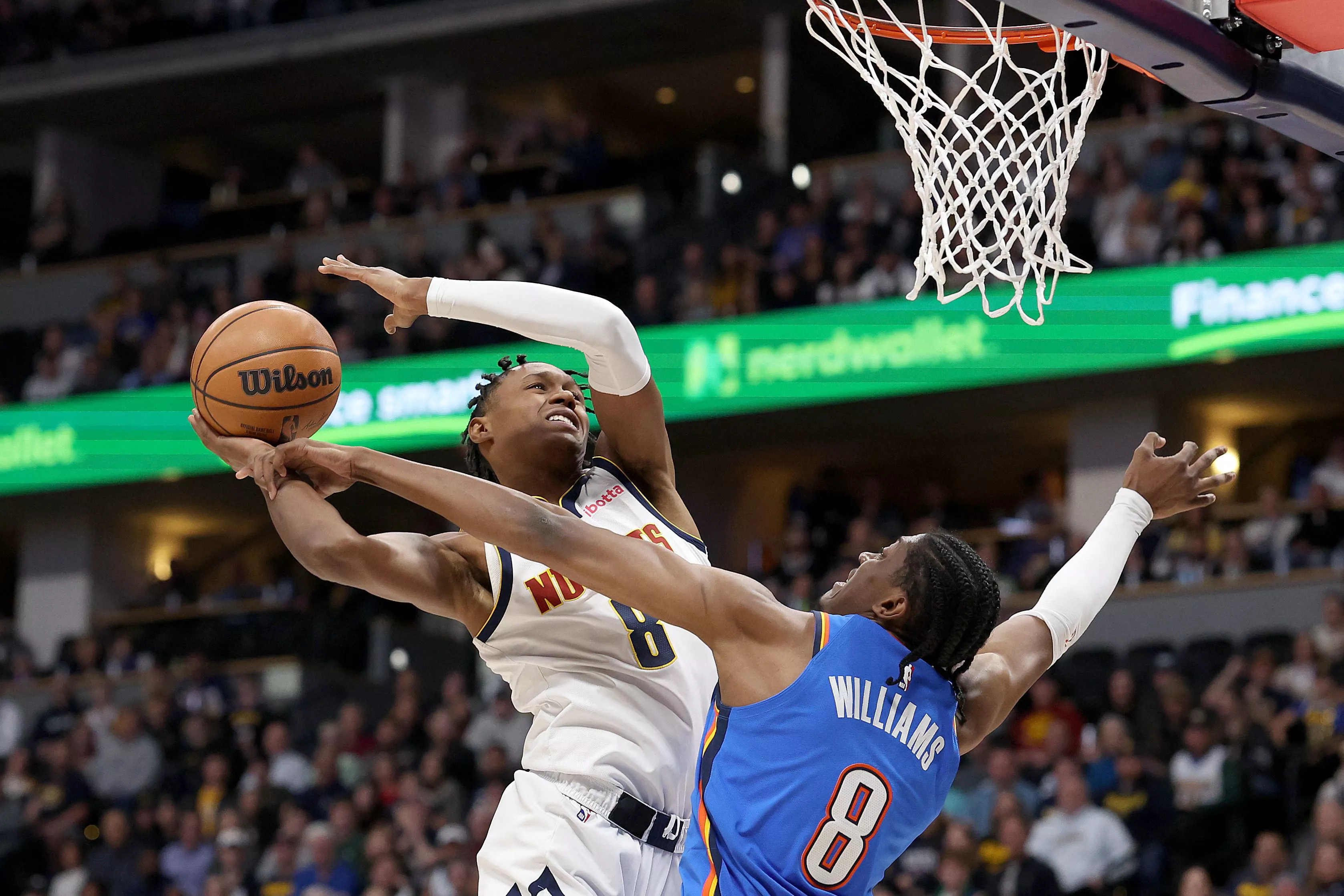 peyton watson 8 o denver nuggets is fouled going to the basket by jalen williams 8 of the oklahoma city thunder in the first quarter at ball arena on saturday photo afp peyton watson 8 o denver nuggets is fouled going to the basket by jalen williams 8 of the oklahoma city thunder in the first quarter at ball arena on saturday photo afp