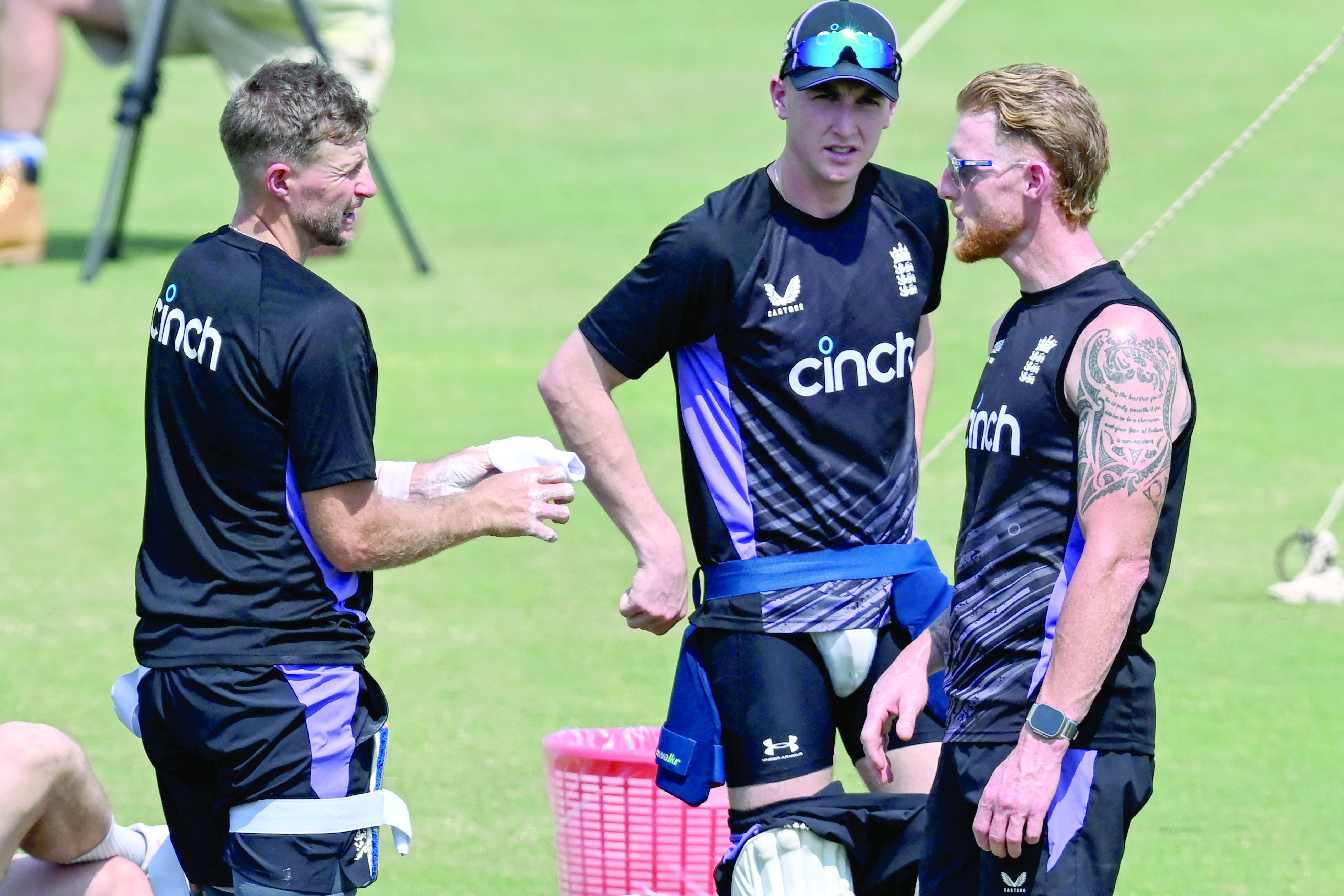 england cricket captain ben stokes r and teammates joe root l and harry brook c attend a practice session at multan cricket stadium on friday photo afp