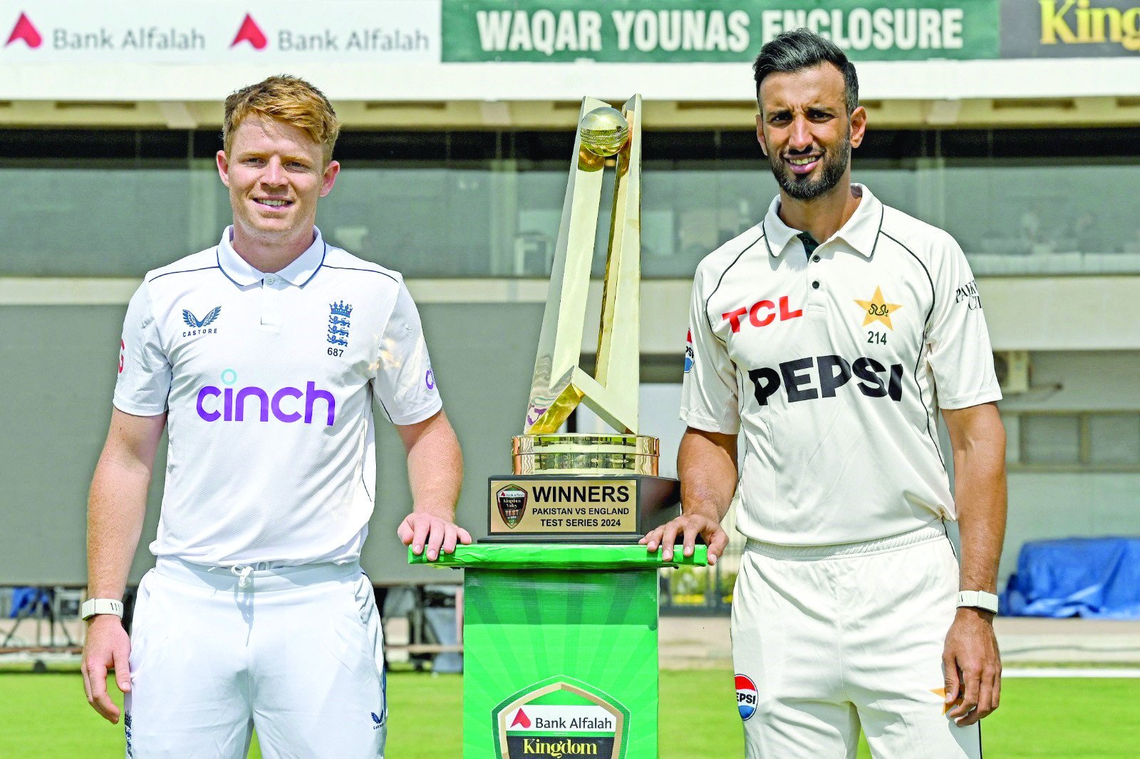 england captain ollie pope l and pakistani captain shan masood pose with the test series trophy at multan cricket stadium on sunday photo afp