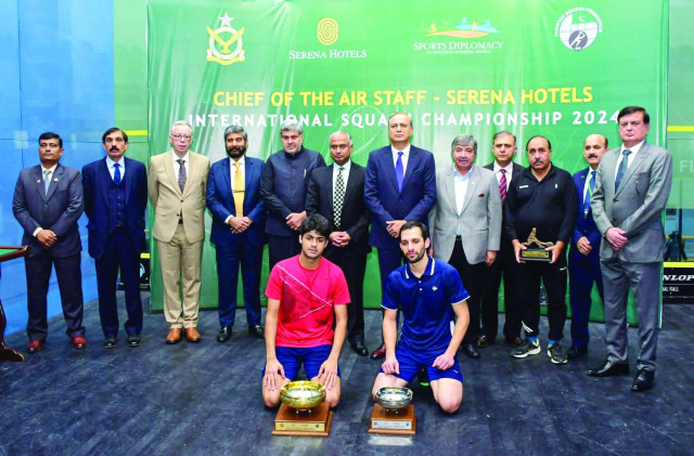winner noor zaman of pakistan and runner up nasir iqbal are seen with their trophies as they pose with chief guest air marshal shakil ghazanfar former champion qamar zaman and other officials after the cas serena squash final on saturday photo app winner noor zaman of pakistan and runner up nasir iqbal are seen with their trophies as they pose with chief guest air marshal shakil ghazanfar former champion qamar zaman and other officials after the cas serena squash final on saturday photo app