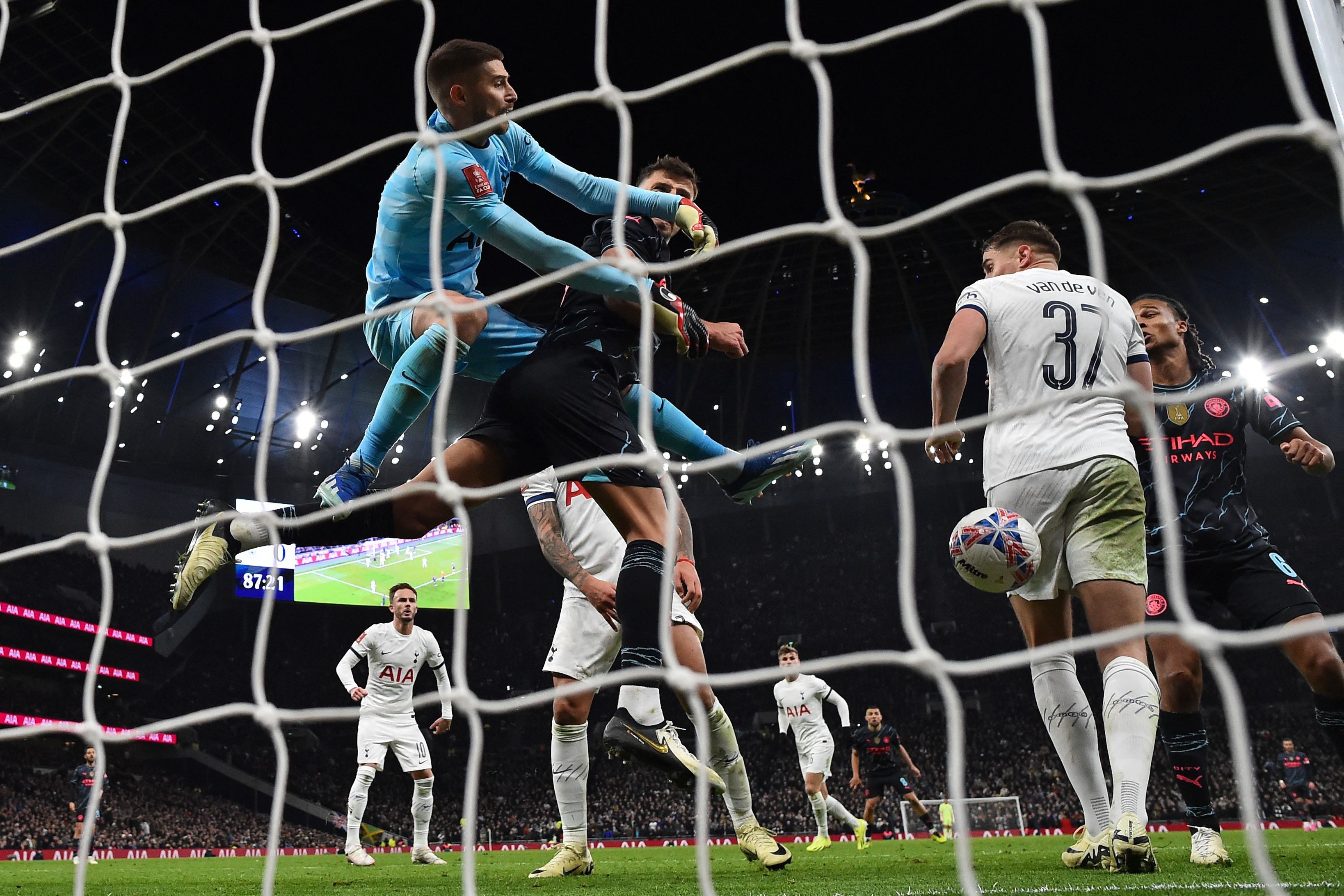 tottenham hotspur s goalkeeper guglielmo vicario l fails to punch the ball clear as city s forwards attack in their english fa cup fourth round on saturday photo afp