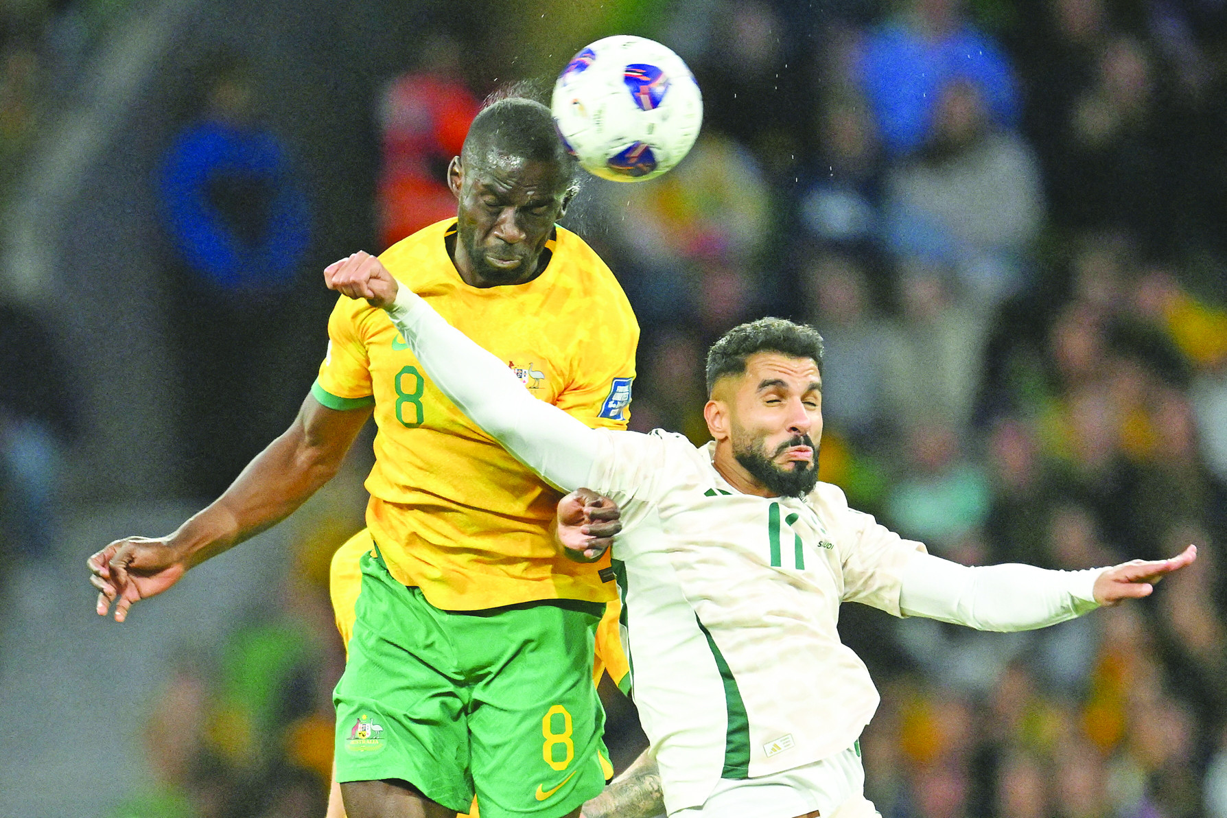 tempers fly australia s jason geria vie for ball control against saudi arabia s saleh al shehri joel during their world cup qualifier photo reuters