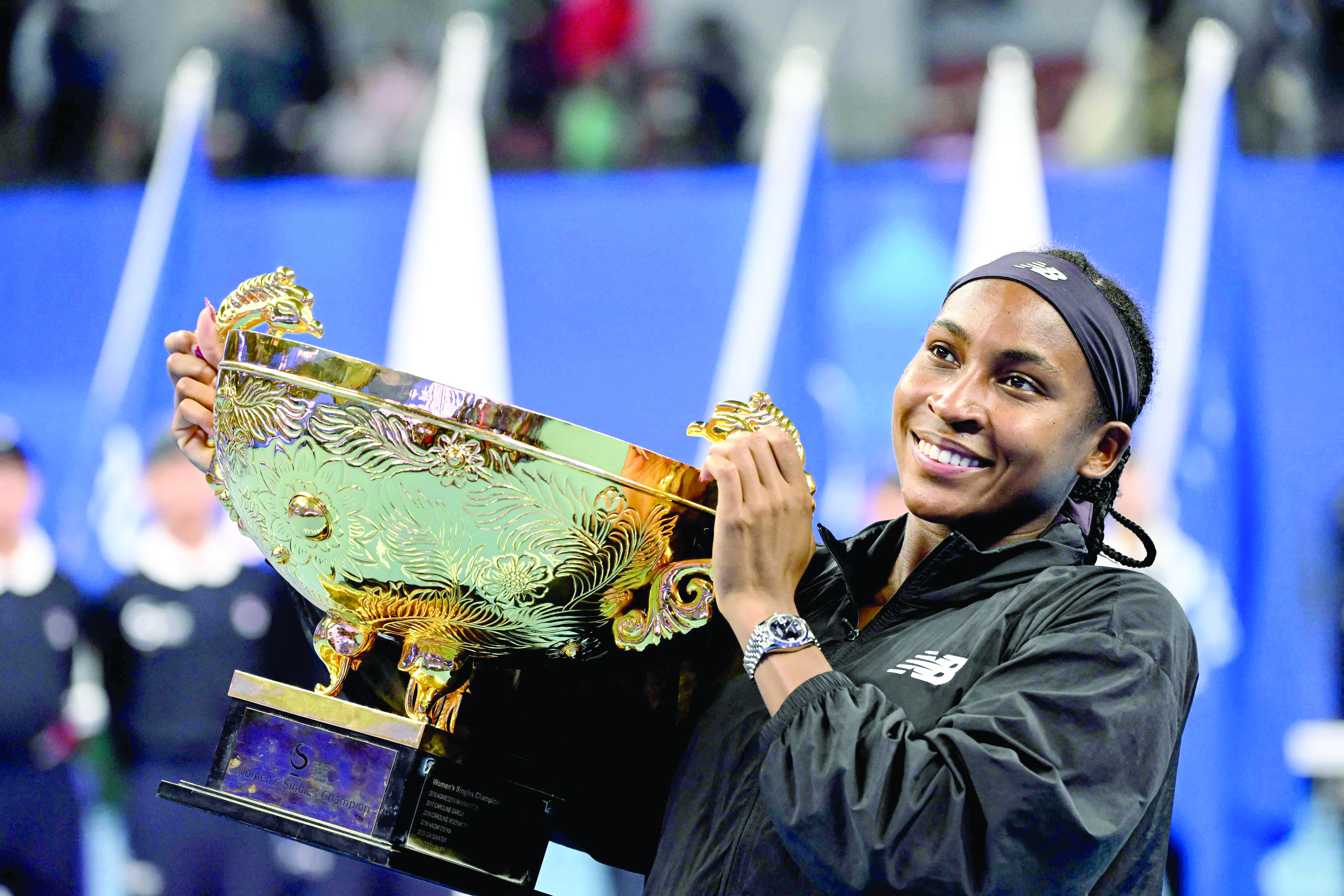 usa s coco gauff celebrates with her trophy after winning china open tennis tournament in beijing on sunday photo afp