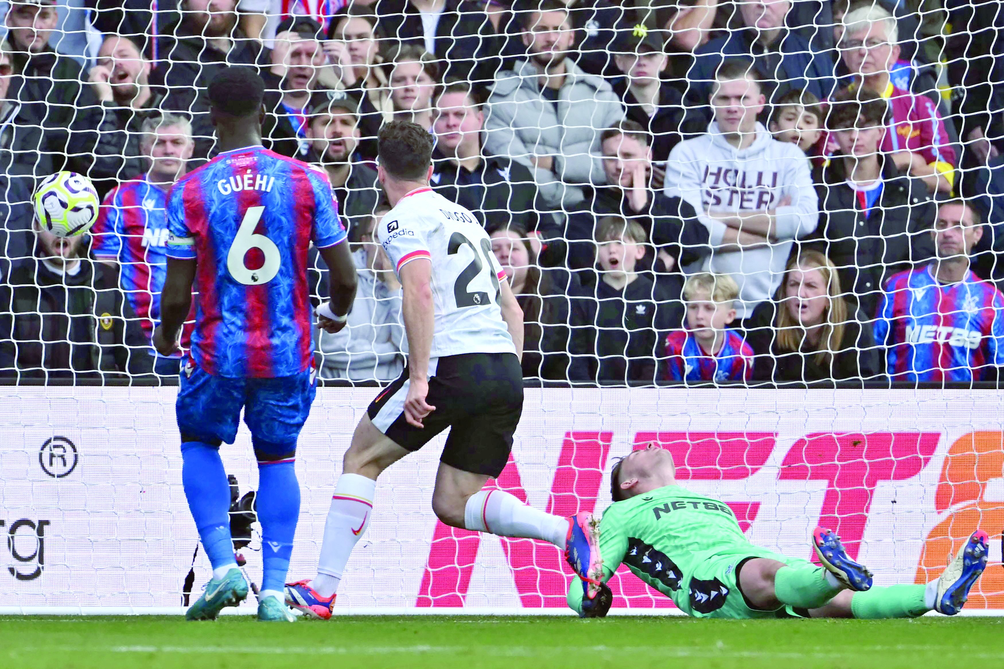 liverpool s portuguese striker diogo jota c scores opening goal past crystal palace goalkeeper during the english premier league football match on october 5 2024 photo afp