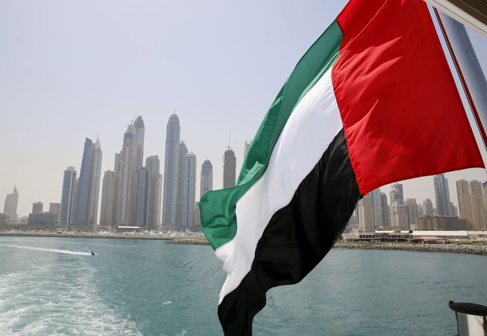 uae flag flies over a boat at dubai marina dubai united arab emirates may 22 2015 photo reuters