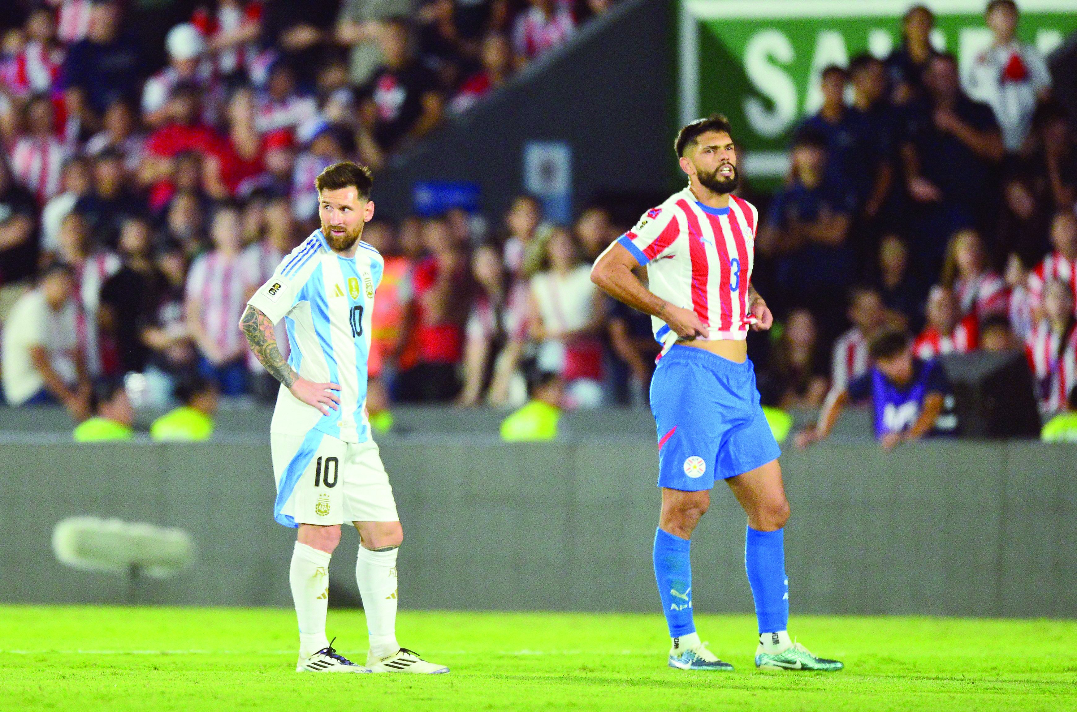 argentina s lionel messi and paraguay s omar alderete react during the 2026 fifa world cup south american qualifiers football match at the ueno defensores del chaco stadium photo afp