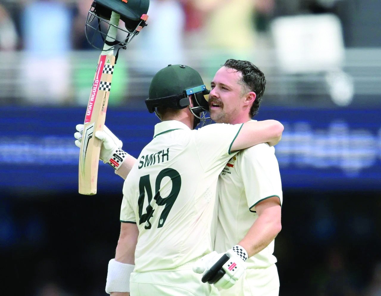 travis head celebrates his century with steven smith photo afp