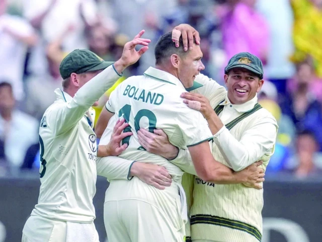 scott boland is mobbed by his teammates after the wicket of virat kohli photo afp scott boland is mobbed by his teammates after the wicket of virat kohli photo afp