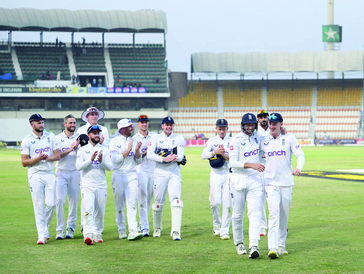 harry brook and joe root lead the england players off photo afp