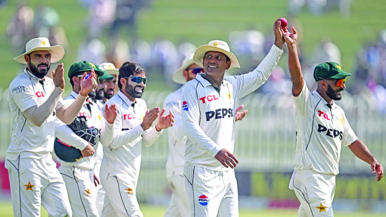 noman ali and sajid khan lead pakistan off the field after sharing all ten wickets during third test victory in rawalpindi on october 26 2024 photo afp