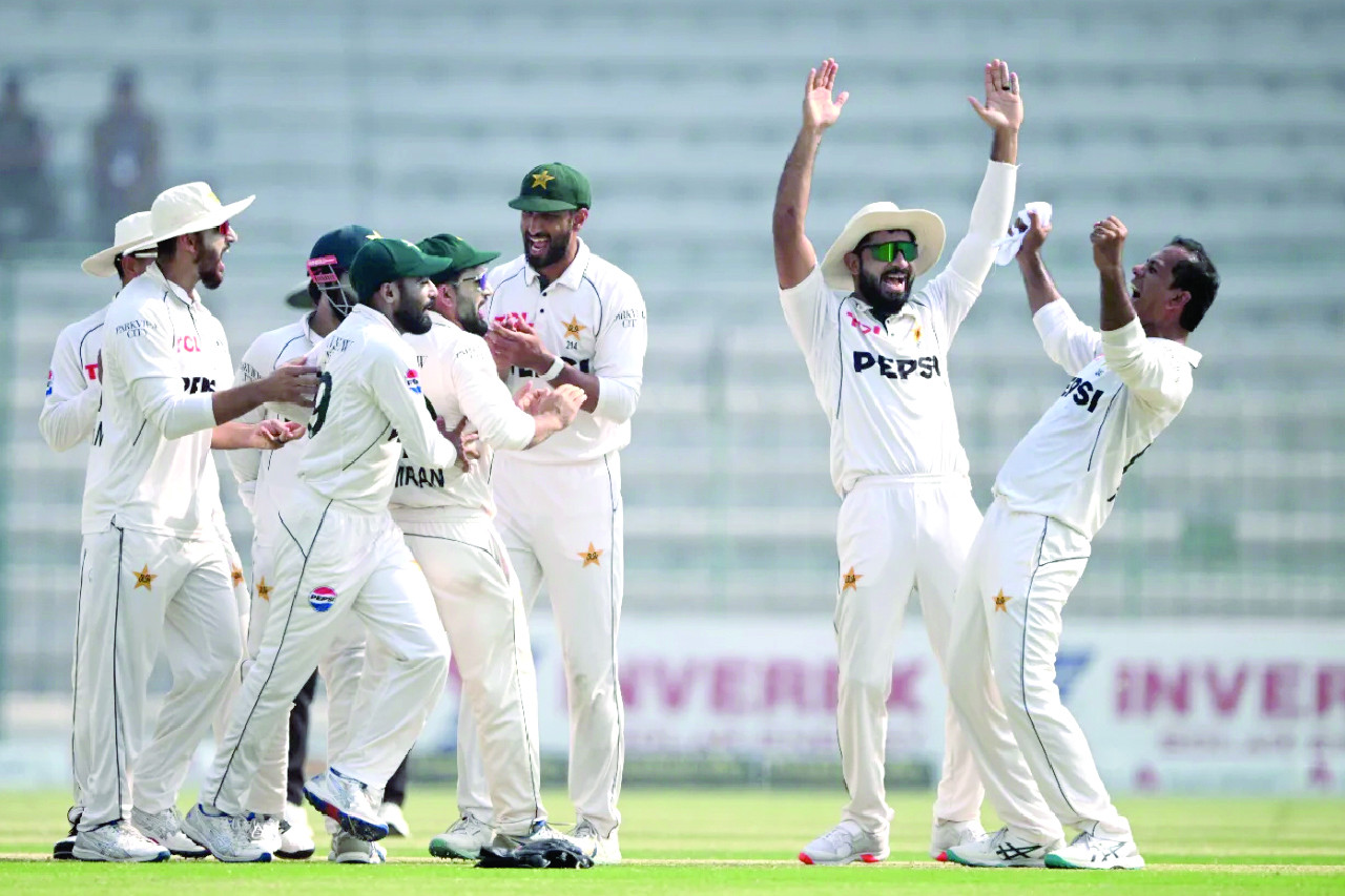 noman ali leads pakistan celebrations during the second test against england in multan photo afp