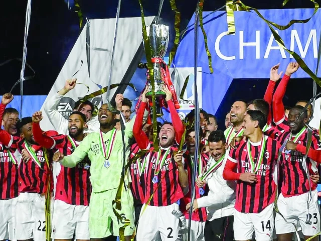 ac milan s davide calabria lifts the trophy as he celebrates with teammates after winning the italian super cup photo reuters