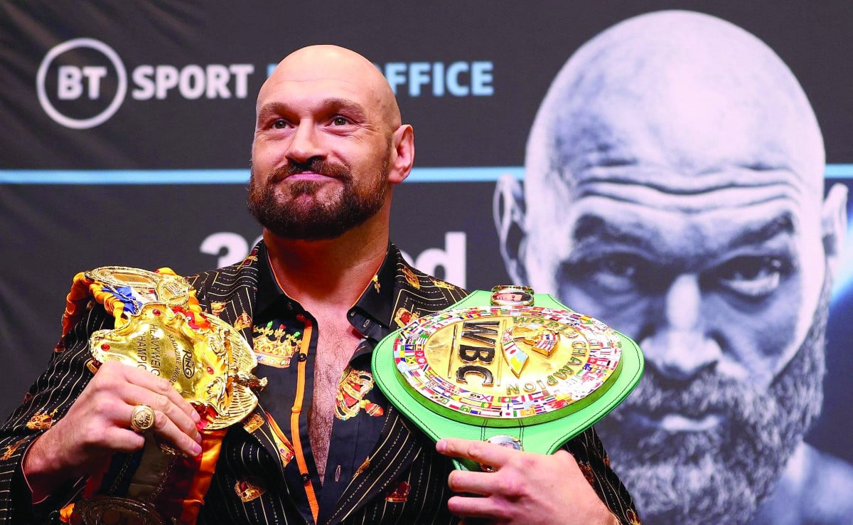 wbc heavyweight title holder britain s tyson fury takes part in a pre fight press conference at wembley stadium in west london photo afp file