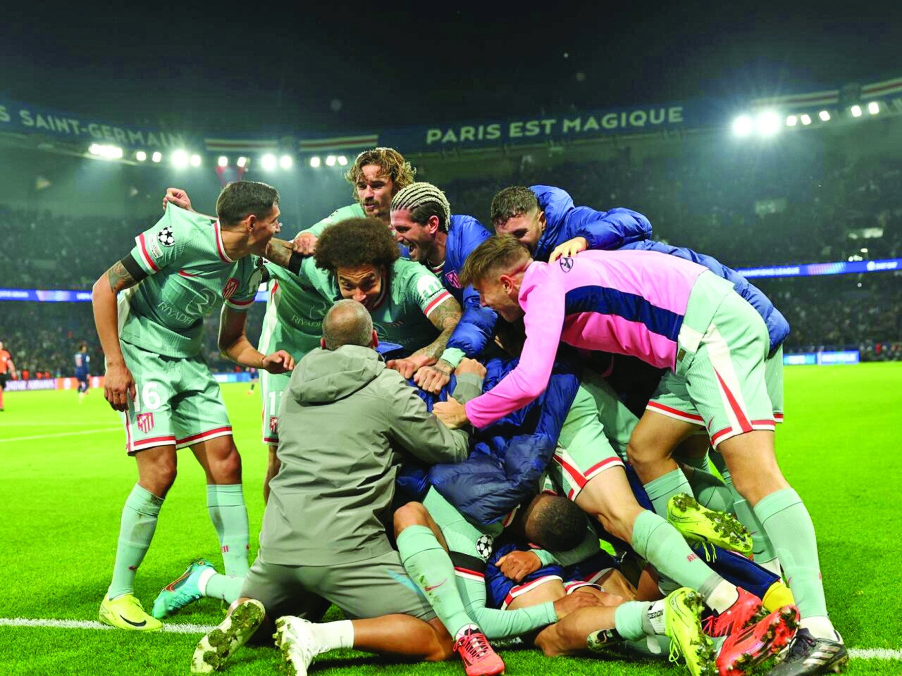 atletico madrid players celebrate after angel correa s late goal against paris saint germain photo afp