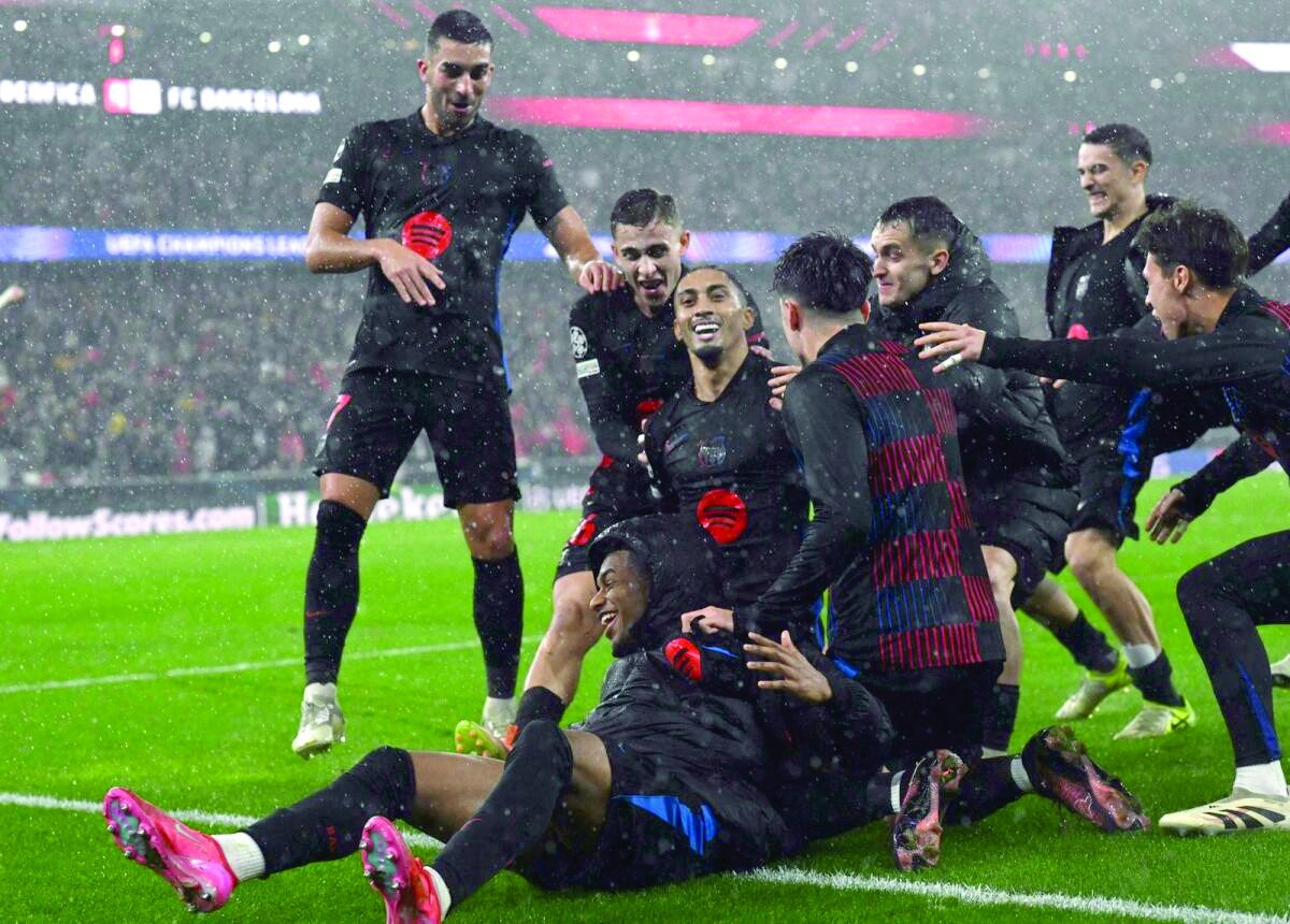 barcelona forward raphinha centre celebrates the comeback victory with teammates photo afp