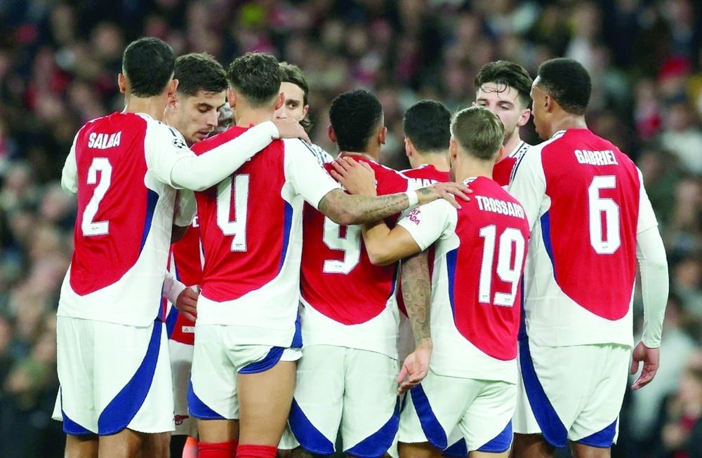 arsenal players celebrate the own goal against shakhtar at home photo afp