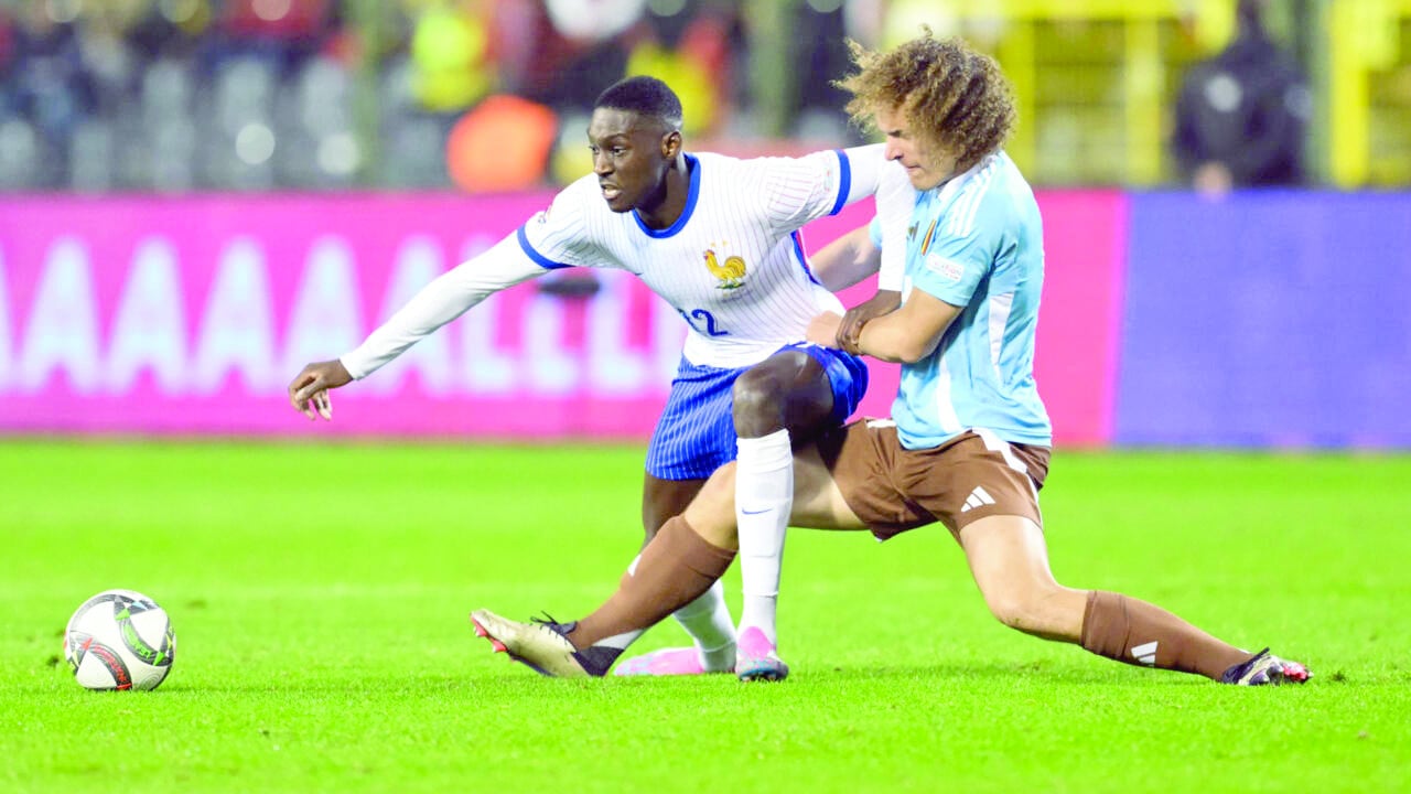 randal kolo muani l in the duel with belgian defender wout faes during the belgium france match at the king baudouin stadium in brussels photo afp