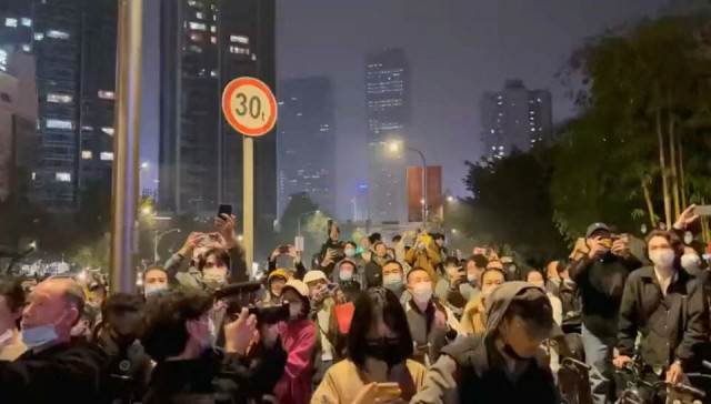 protesters chant slogans in support of freedom of speech and the press amid broader nationwide unrest due to covid 19 lockdown policies in chengdu china in this still image obtained from undated social media video released november 27 2022 video obtained by reuters